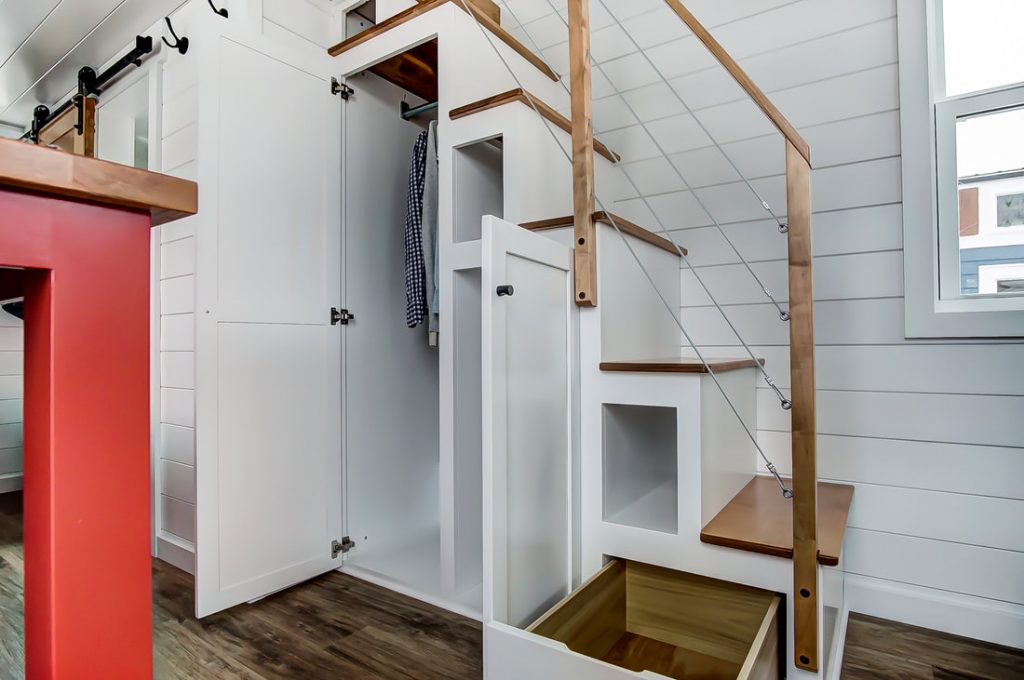 If you want tons of tiny house stair storage then look no further than the currituck from Modern Tiny Living.