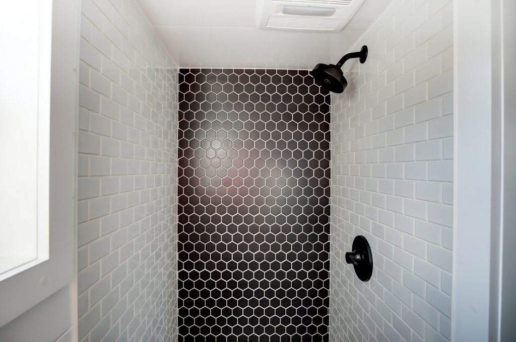 Do tiny houses have showers? Yes, the Braxton from Modern Tiny Living has a gorgeous and spacious walk-in shower.