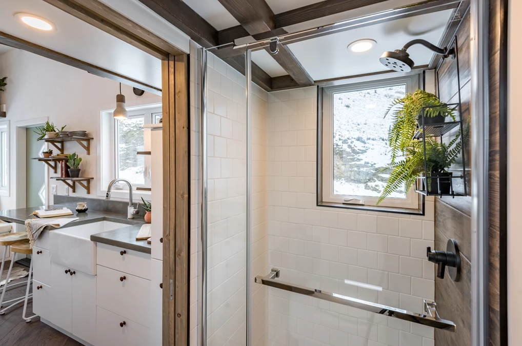 This tiny house shower from Summit Tiny Homes is spacious and features an eye-level window.