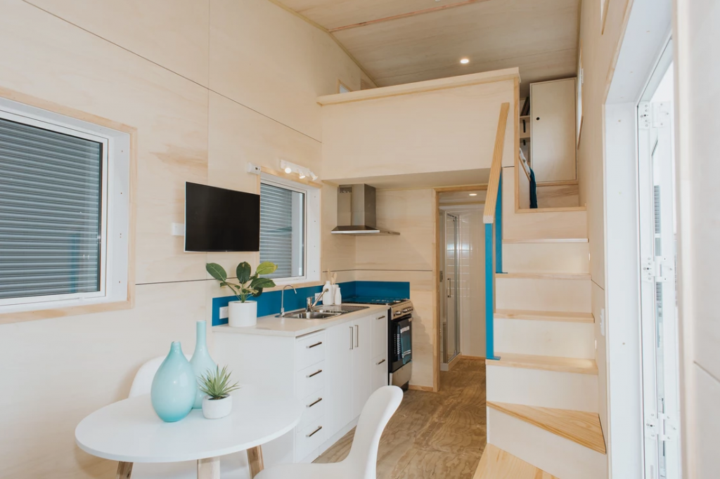 The tiny house kitchen dining table in the Total Grace tiny house by Build Tiny.