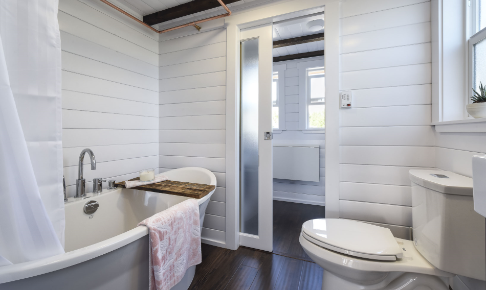 This flush toilet is in the Loft tiny house by Mint Tiny House Company.
