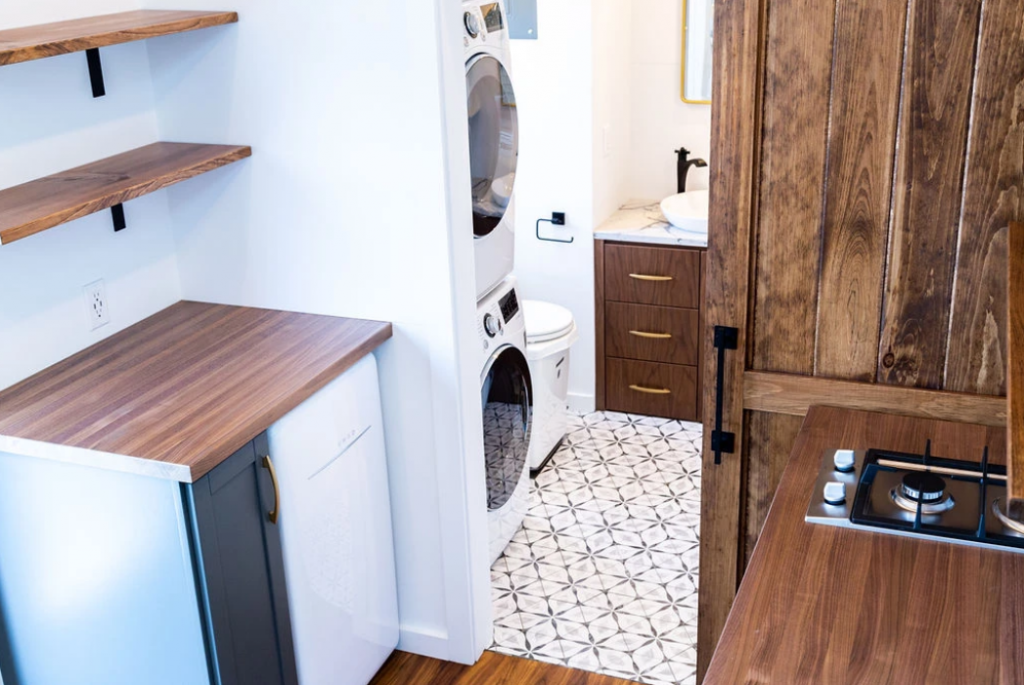 The left side of the kitchen in the Rumspringa tiny house by Liberation Tiny Homes.