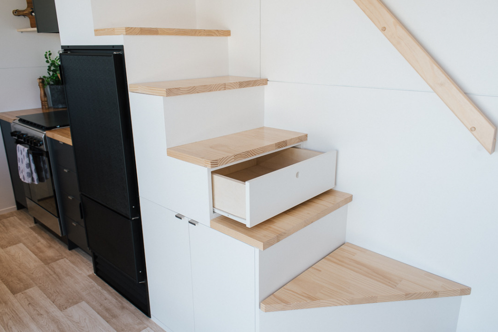 The main staircase has lots of useful storage compartments.