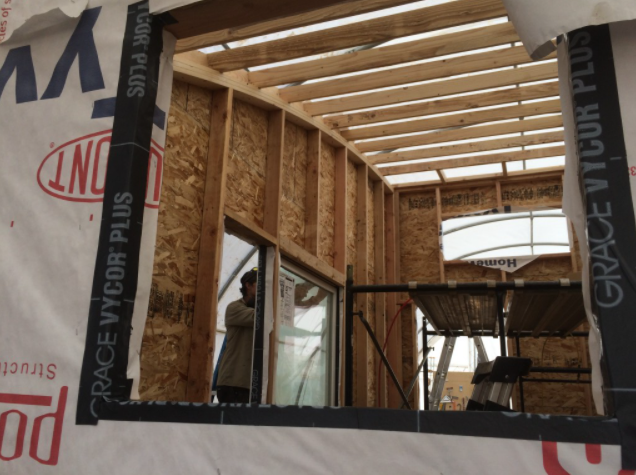 An image of the curved tiny house roof framing from the inside.