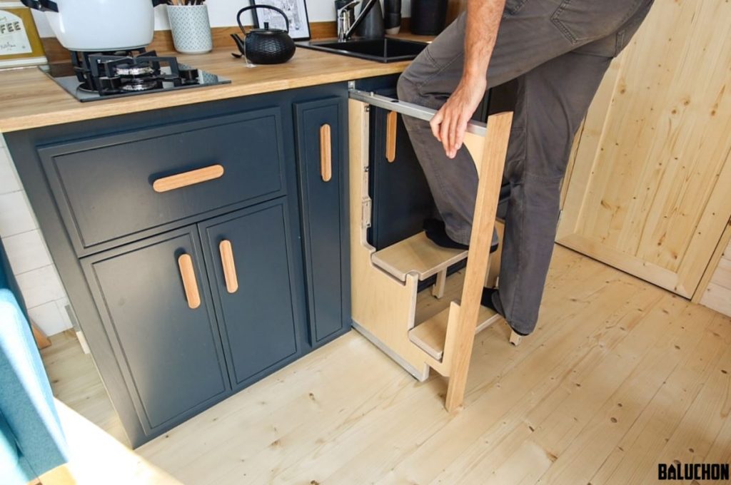 The fold out steps in the Orana tiny house kitchen by Tiny House Baluchon