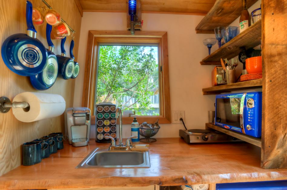 The kitchen in the East Austin tiny house by Rocky Mountain Tiny Homes