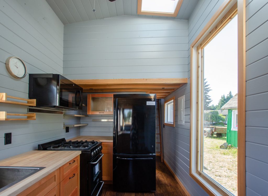 The Surfbird tiny house with a loft that is completely private from the first floor.