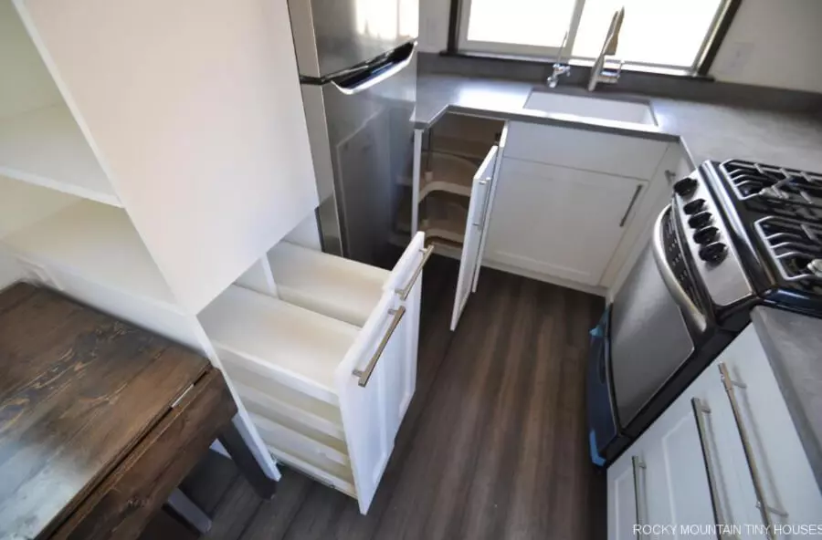 Ad Astra tiny house double pull out pantry in the kitchen