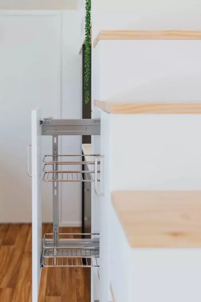 Horton tiny house pantry pulled out from staircase